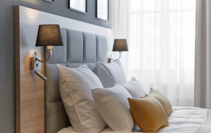 Slaapkamer van hotel 32 Krakow Old Town in Krakau